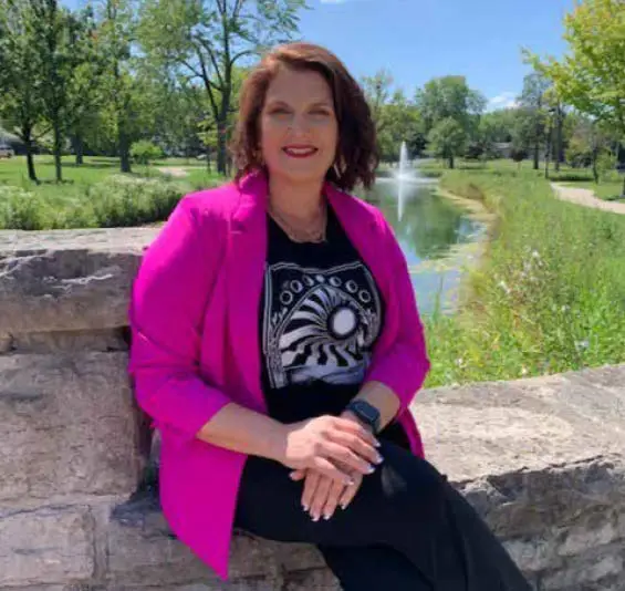 Marla Kopecky Penney sitting in the park.