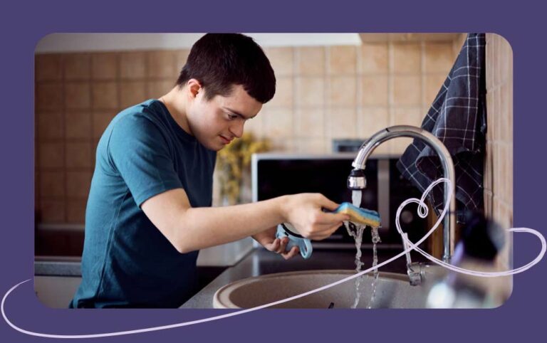 Person with a dissability learning how to wash dishes.