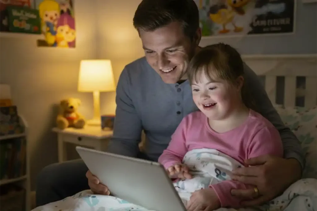 Man and Child Looking at Computer Screen