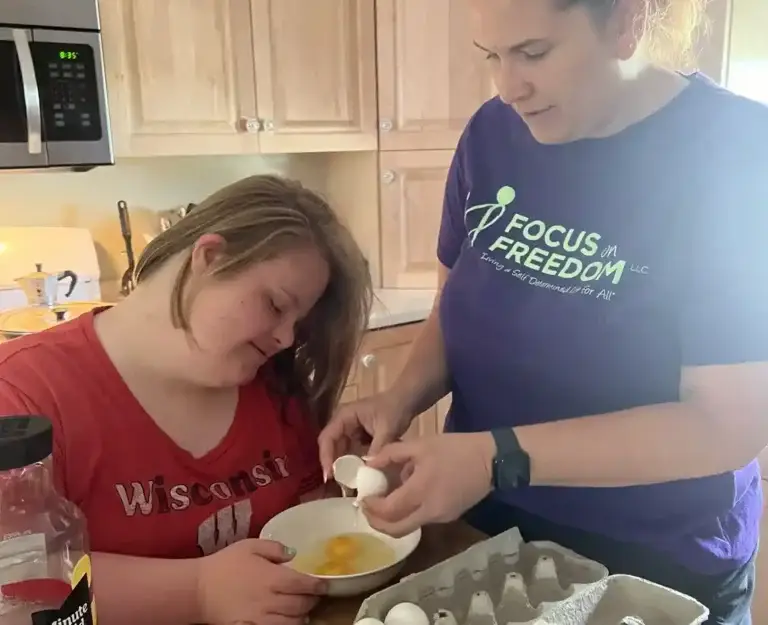 Mother Making Scrambled Eggs With Daughter