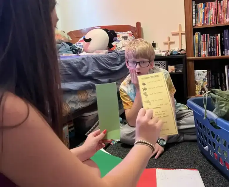 Woman Teaching Young Boy